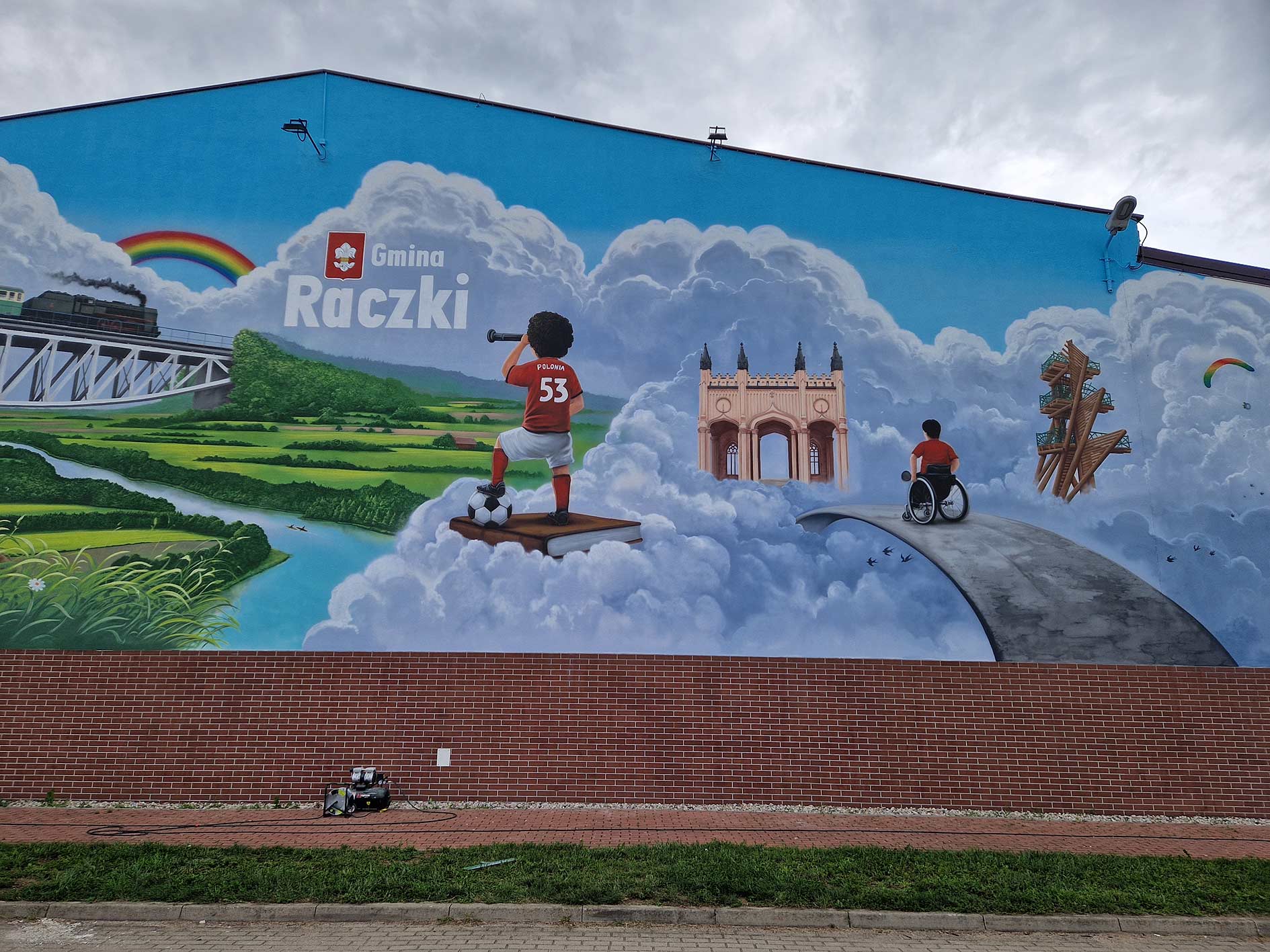 mural, szkoła podstawowa, mural UV, farby ultrafioletowe, montaż lamp UV, pałac Paca, Raczki, Gmina, Wieża widokowa, rospuda, ciuchcia, most